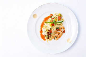 [Translate to English:] Spaghetti mit Shrimps aus dem Fischereihafen Restaurant